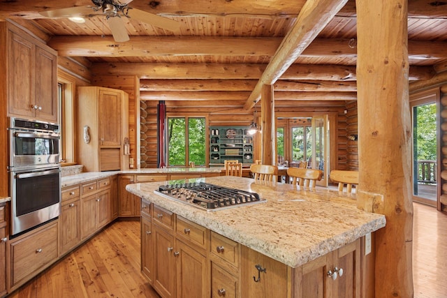 6070 Pilger Ave NW, Annandale, MN 55302 - kitchen with wooden ceiling with exposed beams, appliances with stainless steel finishes, light wood finished floors, log walls, and a kitchen island