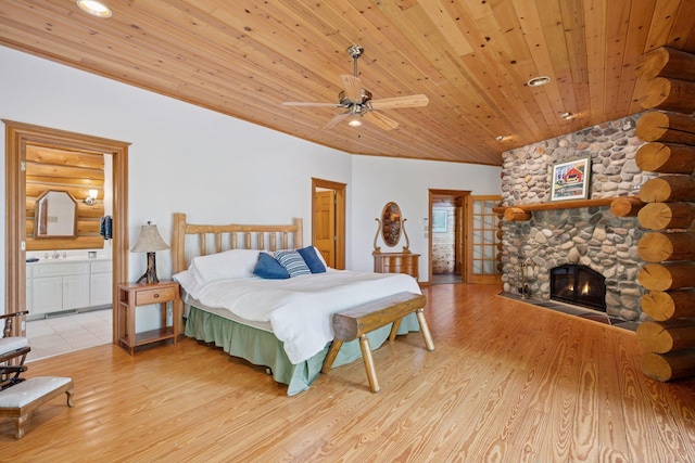 6070 Pilger Ave NW, Annandale, MN 55302 - bedroom with wooden ceiling, light wood finished floors, a fireplace, connected bathroom, and recessed lighting