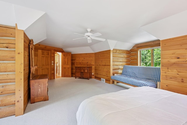 6070 Pilger Ave NW, Annandale, MN 55302 - carpeted bedroom featuring lofted ceiling, wood walls, log walls, and ceiling fan