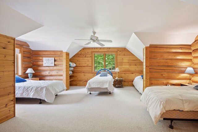 6070 Pilger Ave NW, Annandale, MN 55302 - carpeted bedroom with vaulted ceiling, ceiling fan, and rustic walls