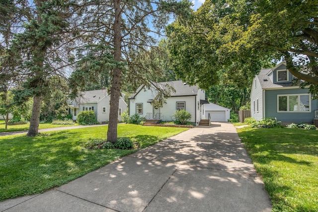 1759 Flandrau St, Maplewood, MN 55109 - view of front of home featuring an outdoor structure, a garage, and a front lawn