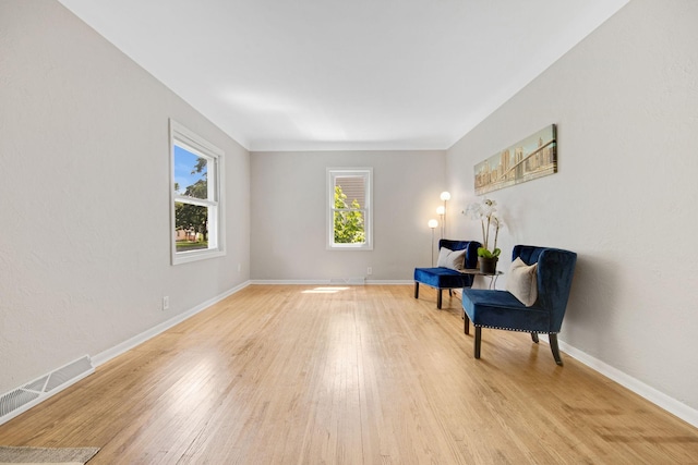 1759 Flandrau St, Maplewood, MN 55109 - sitting room with light wood-style flooring and baseboards