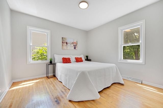 1759 Flandrau St, Maplewood, MN 55109 - bedroom with baseboards and wood finished floors