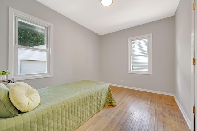 1759 Flandrau St, Maplewood, MN 55109 - bedroom with light wood-style floors and baseboards