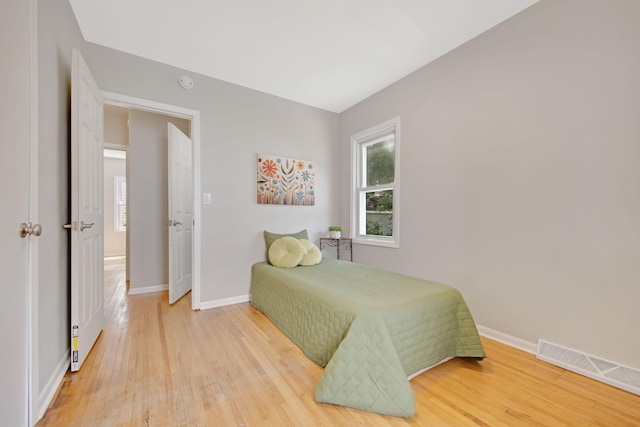 1759 Flandrau St, Maplewood, MN 55109 - bedroom with light wood-style flooring and baseboards