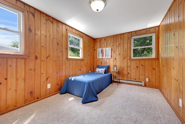 1759 Flandrau St, Maplewood, MN 55109 - bedroom with a baseboard radiator, carpet floors, and wood walls