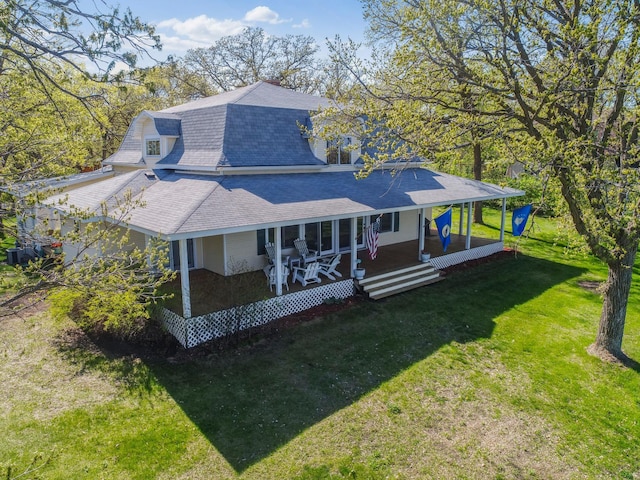 1007 Van Dyke Rd NW, Alexandria, MN 56308 - rear view of property featuring a shingled roof, a yard, and a porch