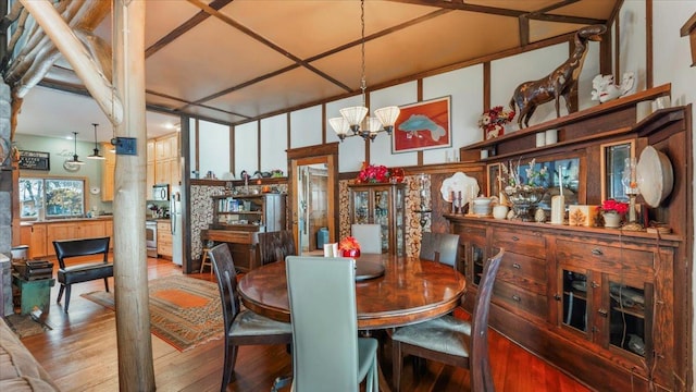 1007 Van Dyke Rd NW, Alexandria, MN 56308 - dining area with wood finished floors and a chandelier