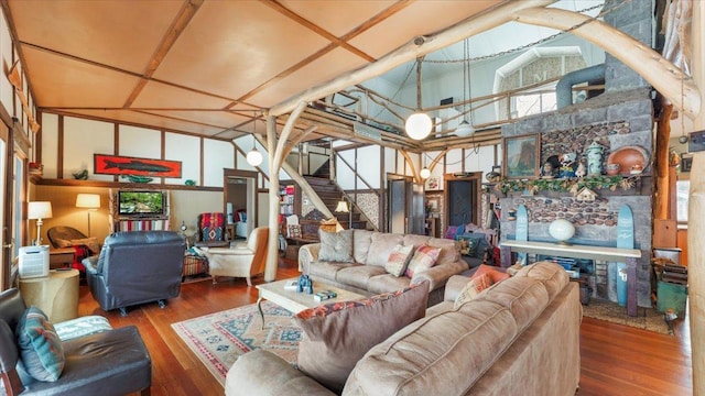 1007 Van Dyke Rd NW, Alexandria, MN 56308 - living room with wood finished floors, stairway, and high vaulted ceiling