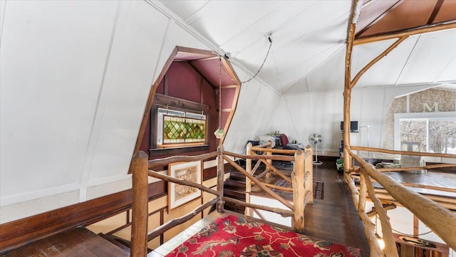 1007 Van Dyke Rd NW, Alexandria, MN 56308 - additional living space featuring hardwood / wood-style flooring, a decorative wall, and lofted ceiling