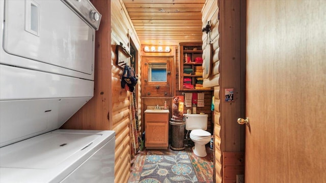 1007 Van Dyke Rd NW, Alexandria, MN 56308 - laundry room featuring stacked washer / dryer and wood ceiling