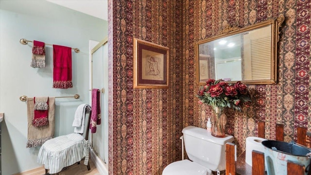 1007 Van Dyke Rd NW, Alexandria, MN 56308 - bathroom with wallpapered walls, a stall shower, toilet, and vanity