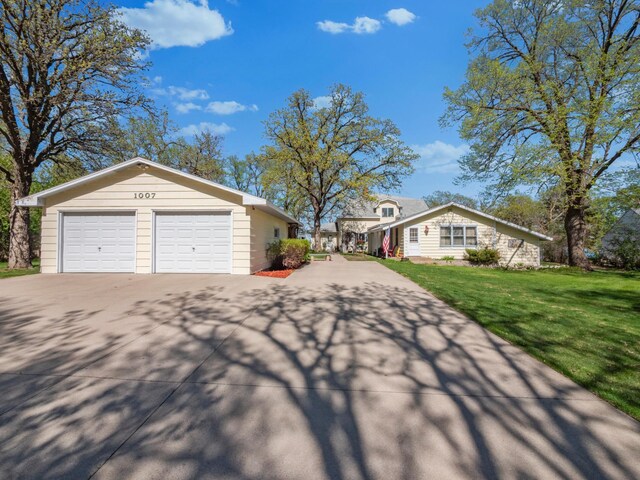 1007 Van Dyke Rd NW, Alexandria, MN 56308 - view of home's exterior with concrete driveway and a lawn