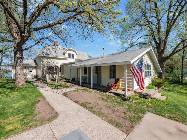 1007 Van Dyke Rd NW, Alexandria, MN 56308 - view of front of property with a porch, a chimney, and a front yard