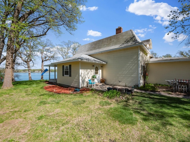 1007 Van Dyke Rd NW, Alexandria, MN 56308 - back of property featuring a chimney, a yard, and a water view