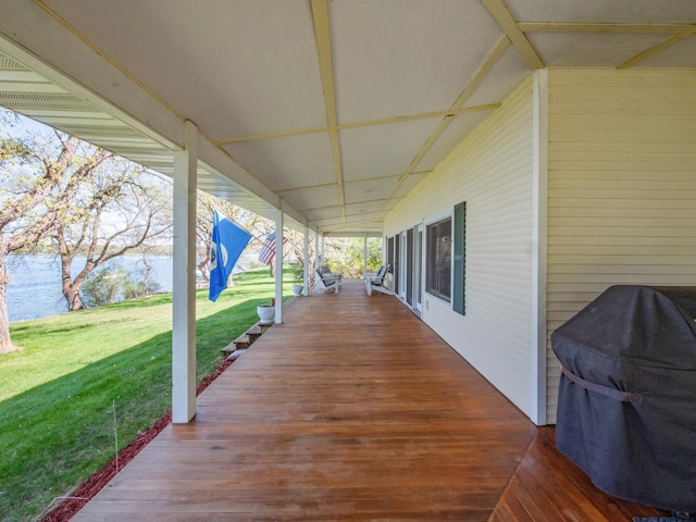 1007 Van Dyke Rd NW, Alexandria, MN 56308 - wooden terrace featuring a lawn and a water view