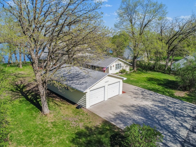 1007 Van Dyke Rd NW, Alexandria, MN 56308 - view of side of property with a yard and a garage