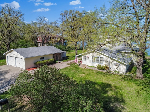 1007 Van Dyke Rd NW, Alexandria, MN 56308 - view of green lawn with a garage and driveway