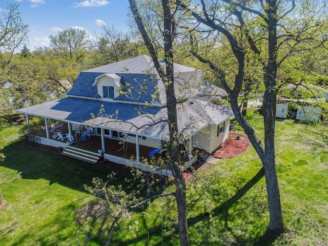 1007 Van Dyke Rd NW, Alexandria, MN 56308 - exterior space featuring a shingled roof, a yard, and a porch
