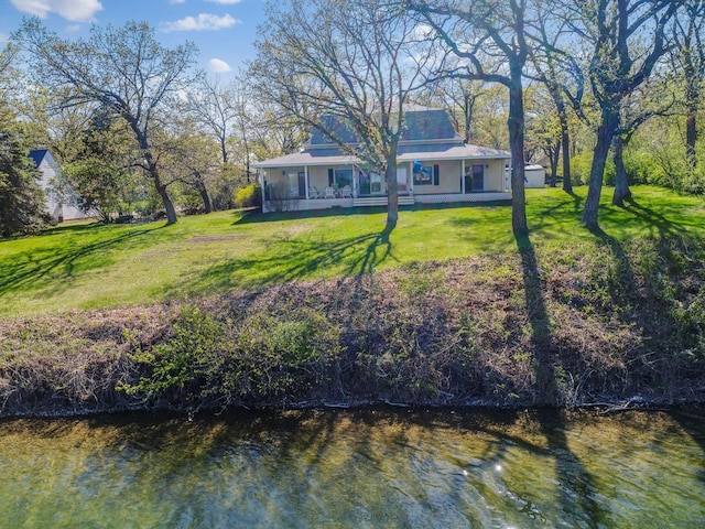 1007 Van Dyke Rd NW, Alexandria, MN 56308 - rear view of property with a yard and a porch