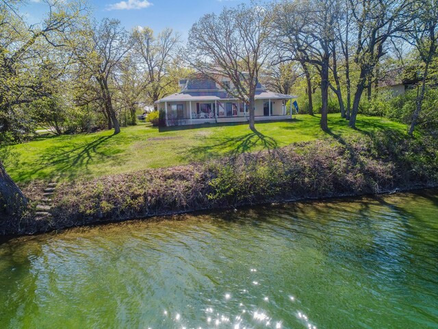 1007 Van Dyke Rd NW, Alexandria, MN 56308 - back of property featuring a lawn and a water view