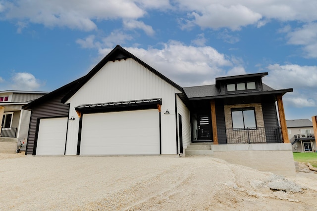 1824 Brandt Dr NE, Byron, MN 55920 - view of front of property with an attached garage, a porch, driveway, and a standing seam roof