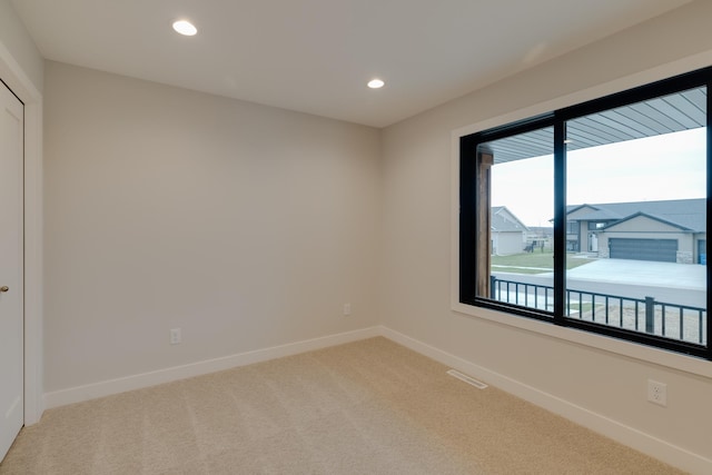 1824 Brandt Dr NE, Byron, MN 55920 - unfurnished room with light carpet, baseboards, and recessed lighting