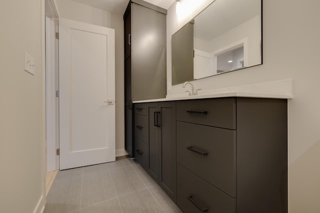 1824 Brandt Dr NE, Byron, MN 55920 - bathroom with tile patterned flooring, vanity, and baseboards