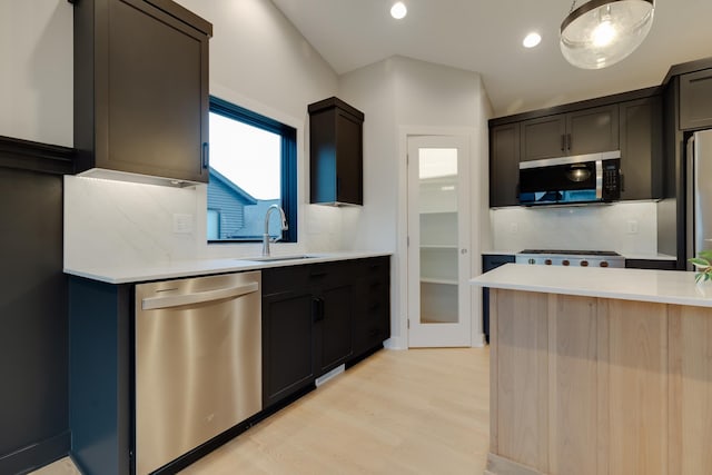 1824 Brandt Dr NE, Byron, MN 55920 - kitchen with stainless steel appliances, a sink, light countertops, light wood-type flooring, and recessed lighting