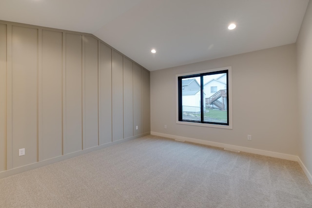 1824 Brandt Dr NE, Byron, MN 55920 - empty room featuring light carpet, baseboards, recessed lighting, and lofted ceiling