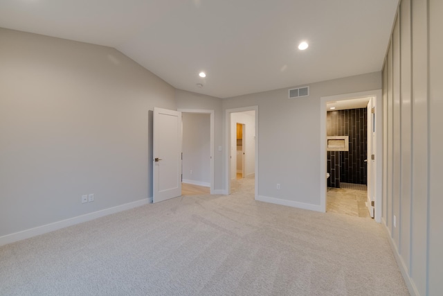 1824 Brandt Dr NE, Byron, MN 55920 - unfurnished bedroom featuring lofted ceiling, light colored carpet, baseboards, recessed lighting, and a spacious closet