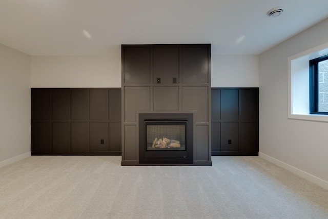 1824 Brandt Dr NE, Byron, MN 55920 - unfurnished living room featuring baseboards, carpet flooring, and a fireplace