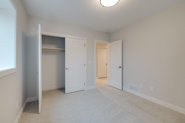 1824 Brandt Dr NE, Byron, MN 55920 - unfurnished bedroom with carpet, a closet, and baseboards