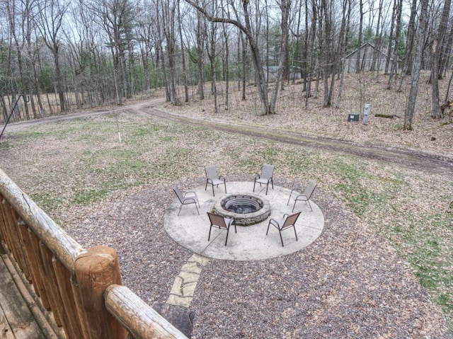 view of yard featuring a patio and an outdoor fire pit