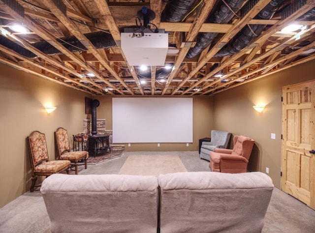 home theater room featuring a wood stove