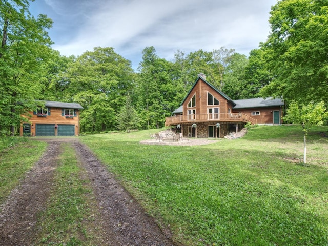 14534 290th Ave, Sampson Twp, WI 54757 - view of grassy yard featuring a wooden deck, driveway, and a garage