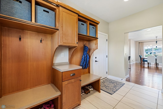2704 1st St E, West Fargo, ND 58078 - mudroom featuring light tile patterned flooring and baseboards