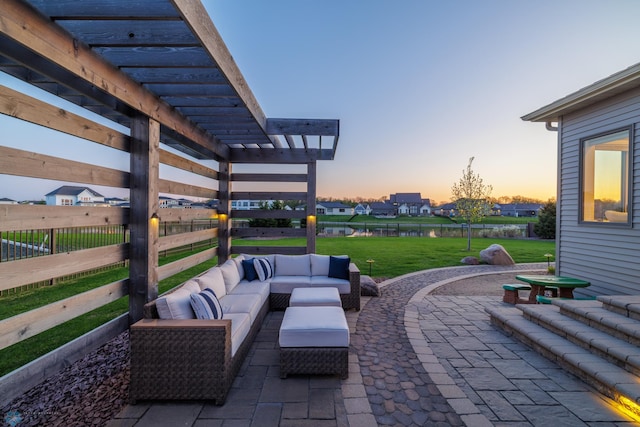 2704 1st St E, West Fargo, ND 58078 - patio terrace at dusk with a pergola, a patio area, and an outdoor living space