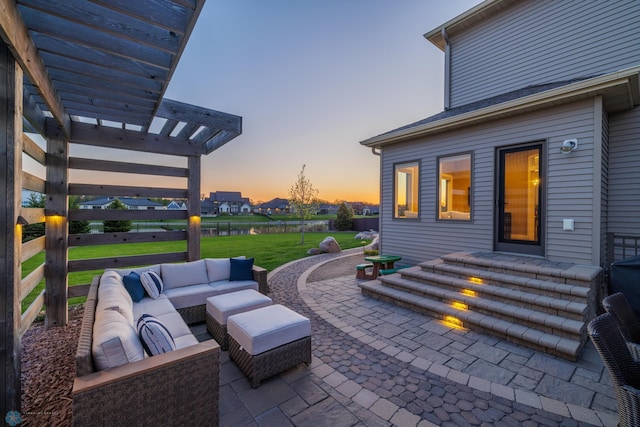 2704 1st St E, West Fargo, ND 58078 - patio terrace at dusk with a pergola, an outdoor living space, a patio, and a lawn