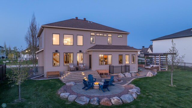 2704 1st St E, West Fargo, ND 58078 - back of property featuring an outdoor fire pit and a patio