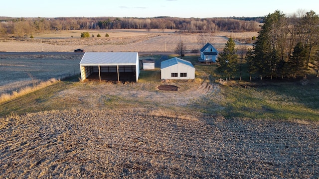 birds eye view of property with a rural view