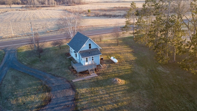 birds eye view of property with a rural view