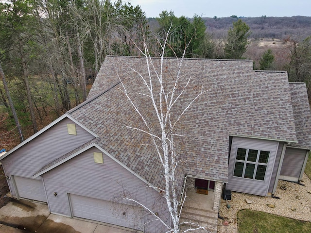 N1698 945th St, Rock Creek Twp, WI 54701 - view of side of property featuring a shingled roof