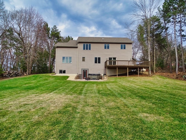N1698 945th St, Rock Creek Twp, WI 54701 - rear view of house featuring a wooden deck, central air condition unit, a lawn, and a patio