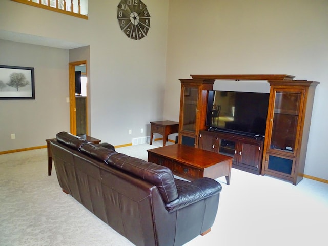 N1698 945th St, Rock Creek Twp, WI 54701 - living area with baseboards, a towering ceiling, visible vents, and carpet