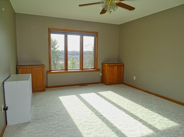 N1698 945th St, Rock Creek Twp, WI 54701 - unfurnished room featuring visible vents, ceiling fan, baseboards, and light colored carpet