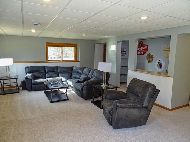 N1698 945th St, Rock Creek Twp, WI 54701 - carpeted living area featuring wainscoting and a paneled ceiling
