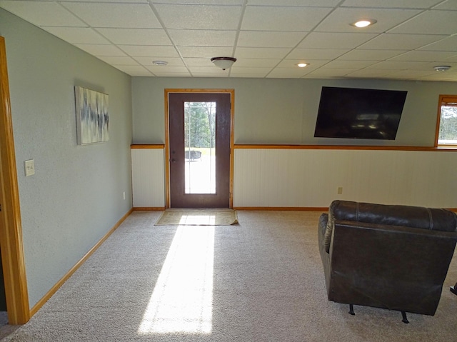 N1698 945th St, Rock Creek Twp, WI 54701 - doorway with carpet floors, a wainscoted wall, baseboards, and a drop ceiling