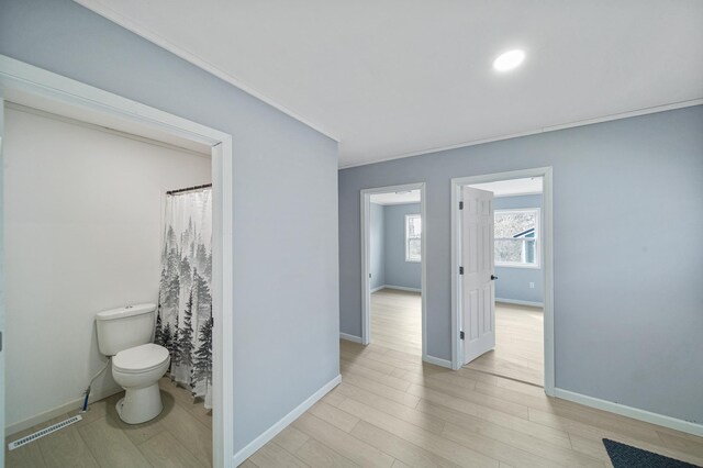 115 Prentice St, Clayton, WI 54004 - bathroom with crown molding, toilet, wood finished floors, baseboards, and visible vents