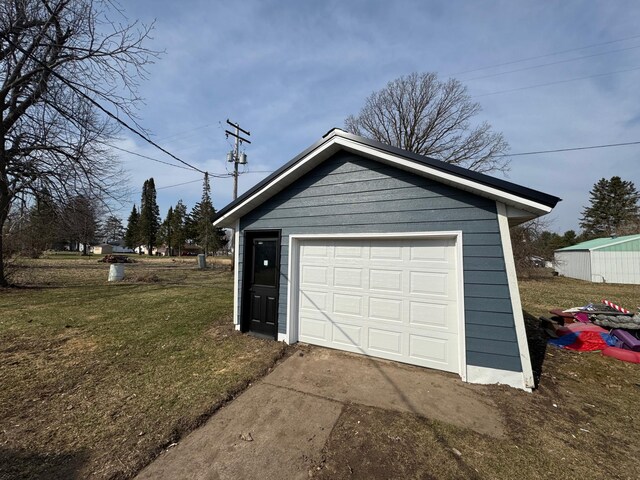 115 Prentice St, Clayton, WI 54004 - detached garage with concrete driveway